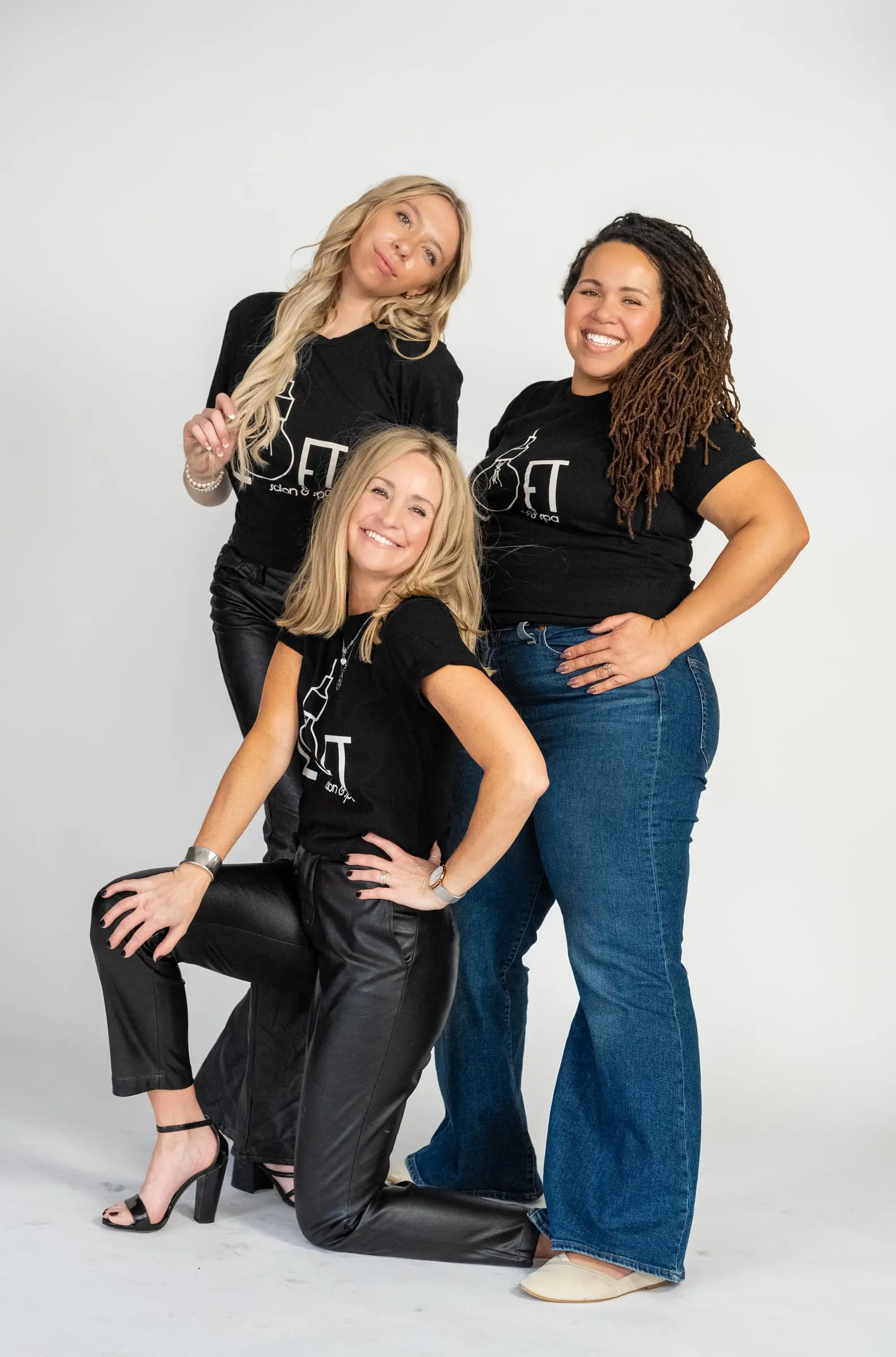 The Loft crew in a group pose, smiling
