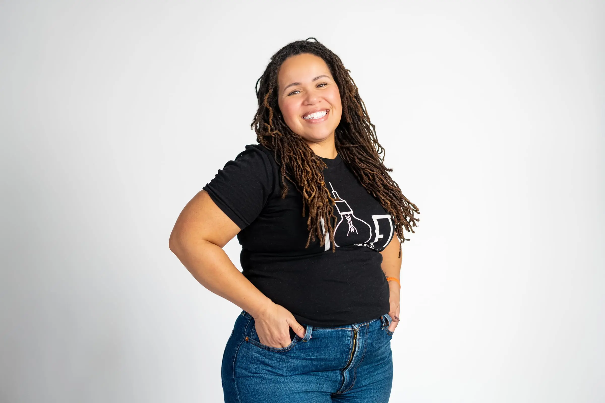 Loft stylist smiling, hand on hip