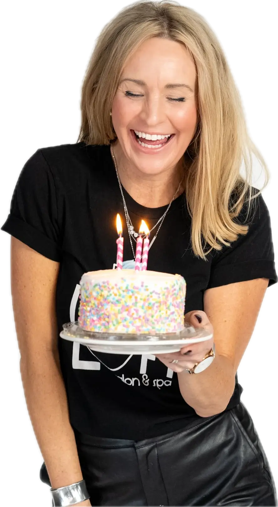 Loft stylist laughing with a sprinkle birthday cake
